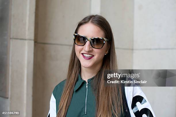 Trend forecaster Dani Marino wearing a Hood By Air shirt, Persol sunglasses on day 2 of Paris Collections: Men on June 26, 2014 in Paris, France.