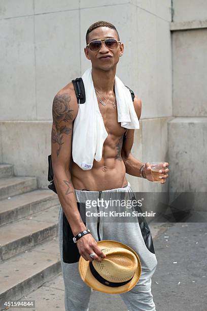 Model Kir They William wearing Germeii Paris bag, LMDR pants and Gucci sunglasses on day 2 of Paris Collections: Men on June 26, 2014 in Paris,...