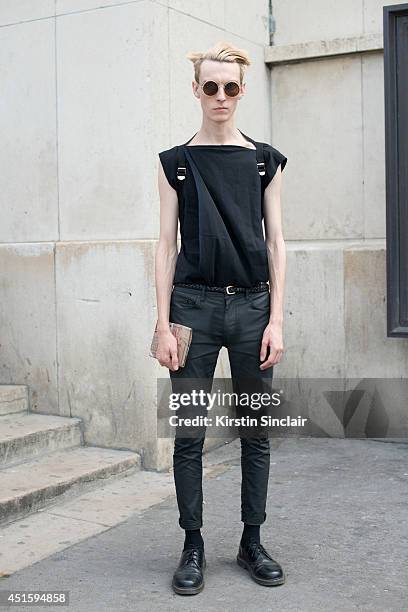 Model Roma Shazuk wearing his own design T shirt, Topshop trousers, Doc Martins shoes and vintage sunglasses on day 2 of Paris Collections: Men on...