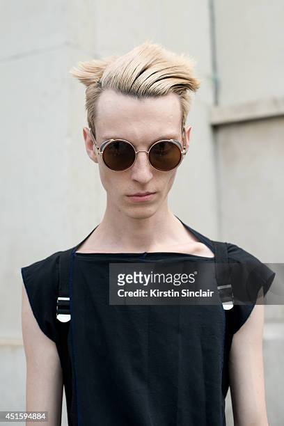 Model Roma Shazuk wearing his own design T shirt and vintage sunglasses on day 2 of Paris Collections: Men on June 26, 2014 in Paris, France.