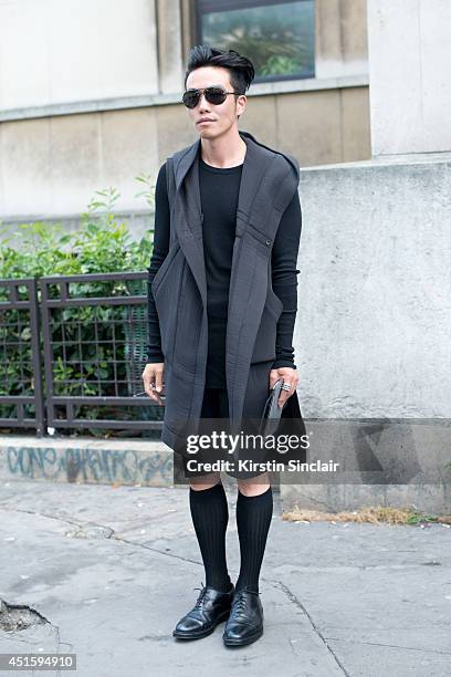 Fashion Editor for Idol Magazine Wei Du wearing a Rick Owens top and jacket, Raf Simons shorts, Tom Brown shoes and Chrome Hearts sunglasses on day 2...