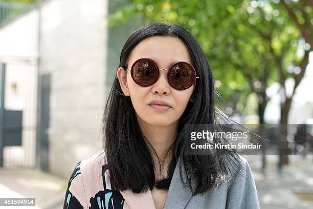 Fashion Editor Sherry Shen wearing a Marni coat and Linda Farrow sunglasses on day 2 of Paris Collections: Men on June 26, 2014 in Paris, France.