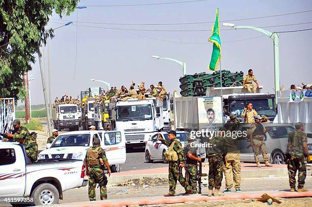 Iraqi forces and mainly Shiite Muslim volunteers arrive in the predominantly-Sunni Muslim city of Samarra, 124 kms from Baghdad on July 2 to protect...