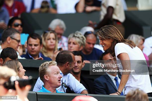 Andy Murray of Great Britain's girlfriend Kim Sears shakes a joke with his coach Amelie Mauresmo during his Gentlemen's Singles quarter-final match...