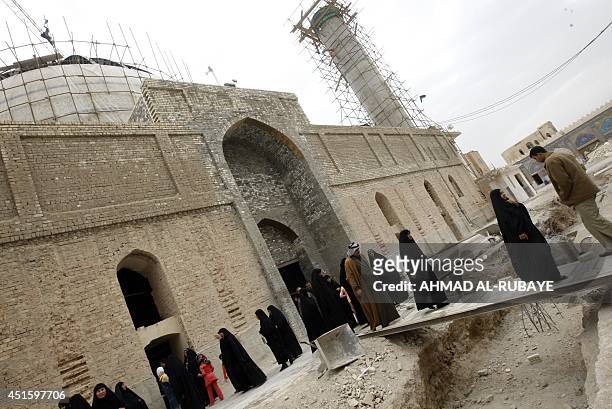 Under repair, pilgrims visit the al-Askari Shrine which embraces the tombs of the 10th and 11th Imams, Ali Al-Hadi and his son Hassan Al-Askari in...