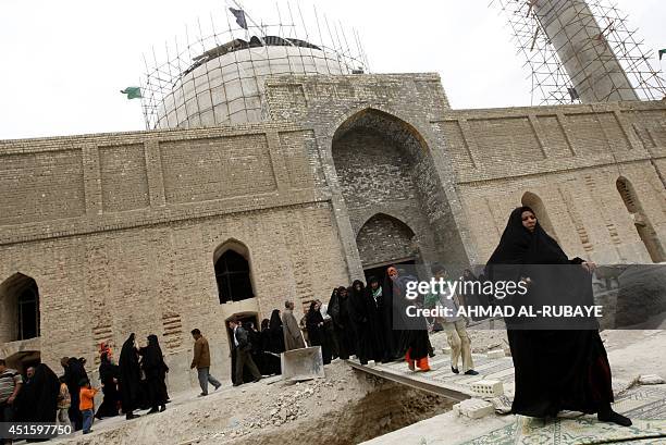 Under repair, pilgrims visit the Al-Askari which embraces the tombs of the 10th and 11th Imams, Ali Al-Hadi his son Hassan Al-Askari in the northern...