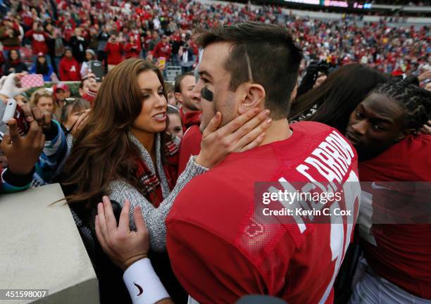 McCarron of the Alabama Crimson Tide celebrates their 49-0 win over the Chattanooga Mocs with his girlfriend Katherine Webb at Bryant-Denny Stadium...