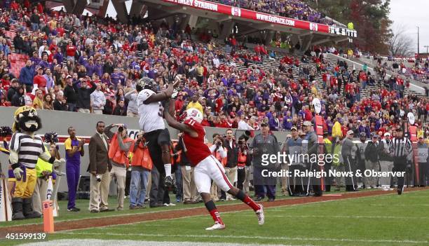 East Carolina wide receiver Lance Ray pulls in a 25-yard touchdown pass against N.C. State cornerback Juston Burris during the second half at...