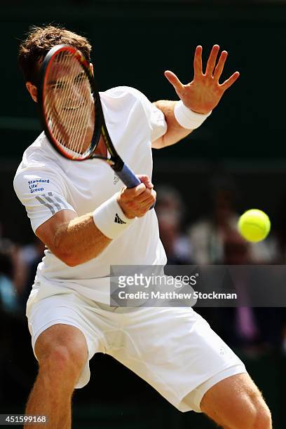 Andy Murray of Great Britain during his Gentlemen's Singles quarter-final match against Grigor Dimitrov of Bulgaria on day nine of the Wimbledon Lawn...