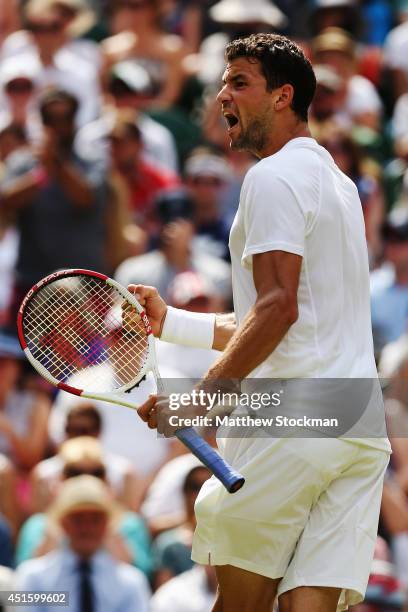 Grigor Dimitrov of Bulgaria celebrates winning the second set during his Gentlemen's Singles quarter-final match against Andy Murray of Great Britain...