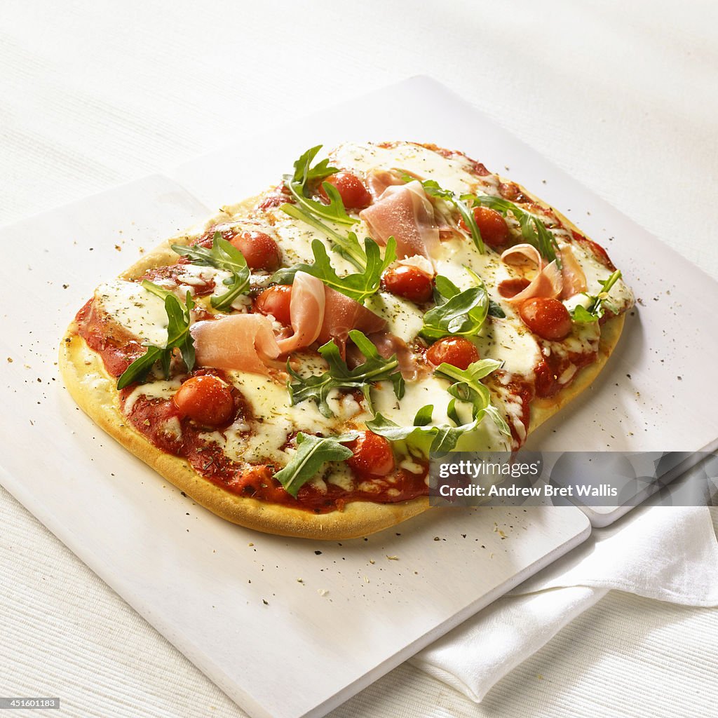 Home-made pizza with fresh salad dressing