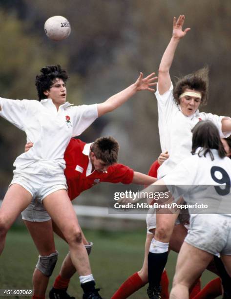 Left to right, Janis Ross of England, Kate Eaves of Wales, Gills Burns and Emma Mitchell of England in line-out action during the women's rugby union...