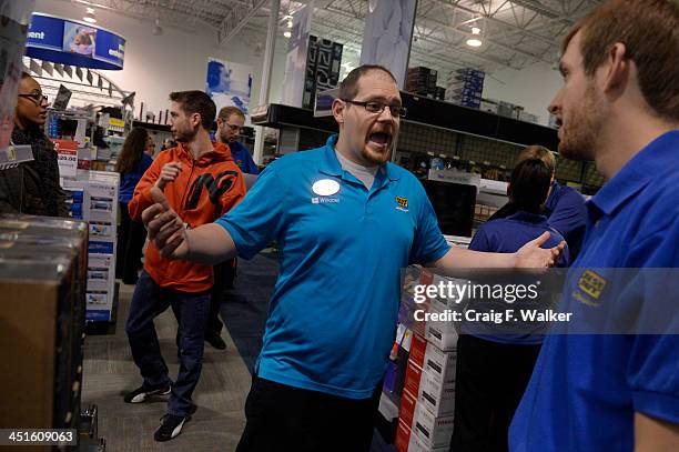 Employee Brent Gill poses a question while playing the part of a customer during a Black Friday rehearsal at the Best Buy in Denver, CO November 23,...