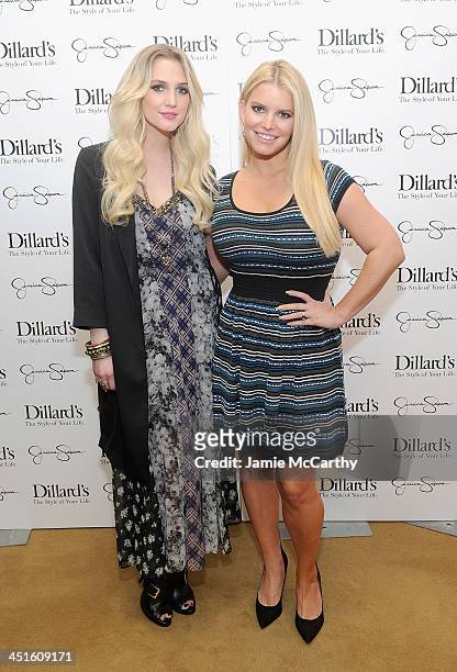 Ashlee Simpson and Jessica Simpson, both wearing Jessica Simpson Collection, attend a Jessica Simpson Collection event at Dillard's on November 23,...