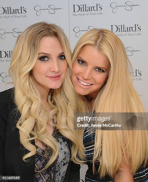Ashlee Simpson and Jessica Simpson, both wearing Jessica Simpson Collection, attend a Jessica Simpson Collection event at Dillard's on November 23,...