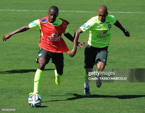 Brazil's Ramires and Fernandinho during a training session for the World Cup 2014 in Teresopolis, Rio de Janeiro state, Brazil on July 2, 2014. AFP...
