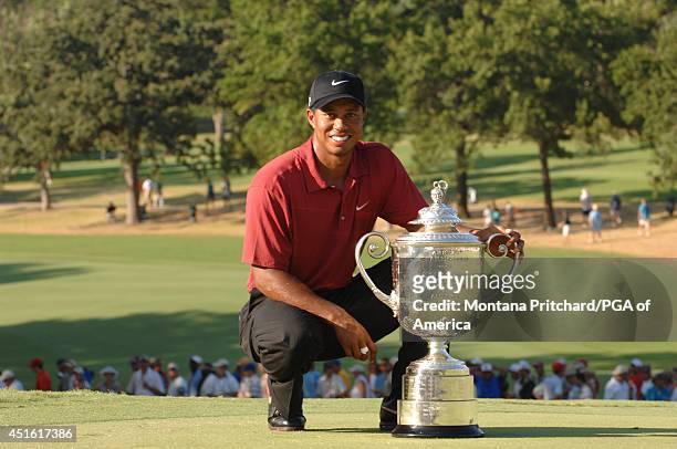Champion Tiger Woods posing with the Wanamaker trophy on 18 green after the Final Round of the 89th PGA Championship held at Southern Hills Country...