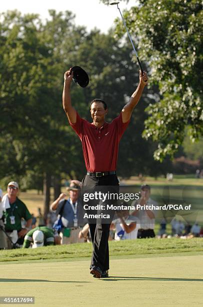 Tiger Woods makes his putt for par and to win the championship on No. 18 green during the Final Round of the 89th PGA Championship held at Southern...