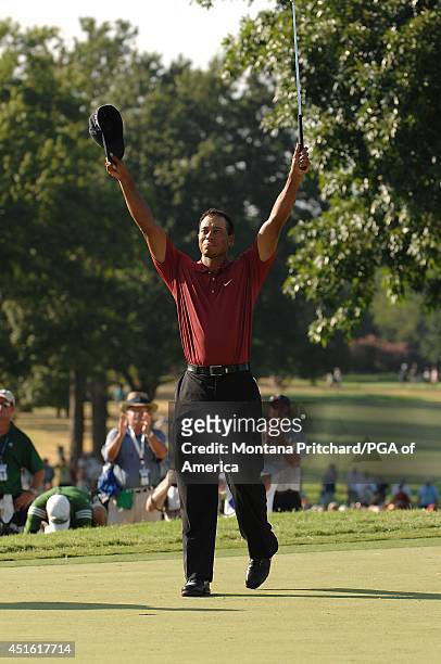 Tiger Woods makes his putt for par and to win the championship on No. 18 green during the Final Round of the 89th PGA Championship held at Southern...