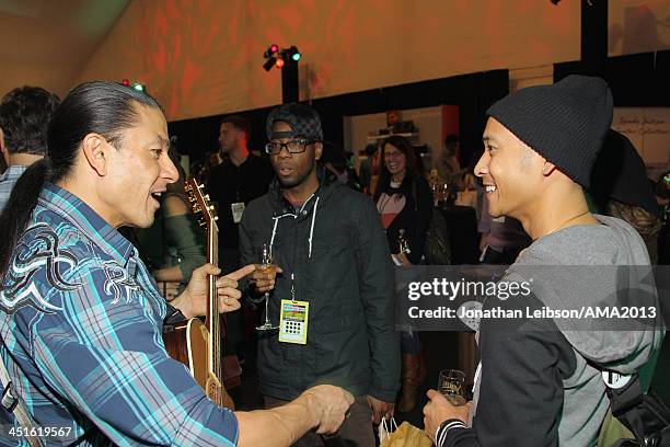 Guitarist Paul Pesco and members of JabbaWockeez attend day 2 of the 2013 American Music Awards gift lounge at Nokia Theatre L.A. Live on November...