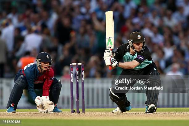 Gary Wilson of Surrey hits out during the Natwest T20 Blast match between Surrey and Kent Spitfires at The Kia Oval on July 2, 2014 in London,...