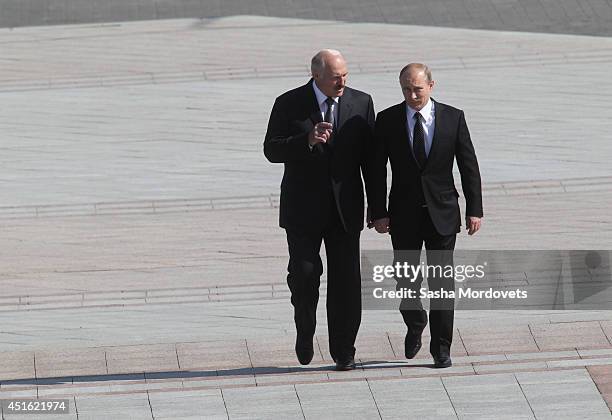 Russian President Vladimir Putin and Belarusian President Alexander Lukashenko arrive at the Great Patriotic War Museum on July 2, 2014 in Minsk,...