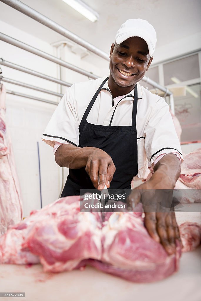 Butcher slicing meat