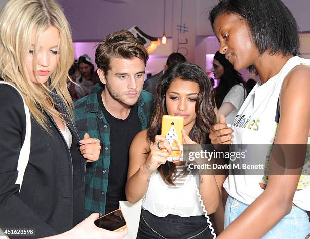 Laura Whitmore, Gary Salter and Vanessa White attend the Nokia Lumia 630 Pop-up store, at The Old Truman Brewery on July 2, 2014 in London, England.