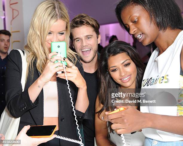 Laura Whitmore, Gary Salter and Vanessa White attend the Nokia Lumia 630 Pop-up store, at The Old Truman Brewery on July 2, 2014 in London, England.