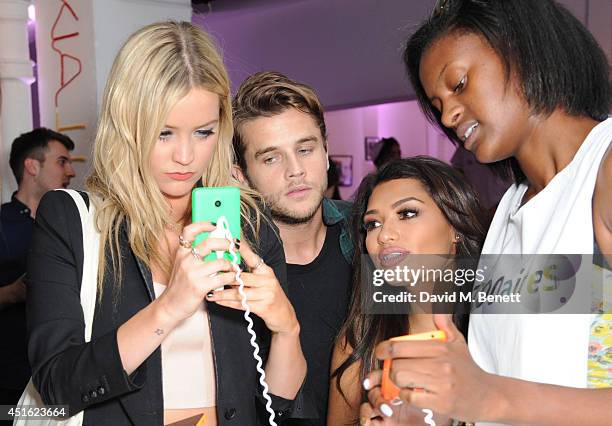 Laura Whitmore, Gary Salter and Vanessa White attend the Nokia Lumia 630 Pop-up store, at The Old Truman Brewery on July 2, 2014 in London, England.