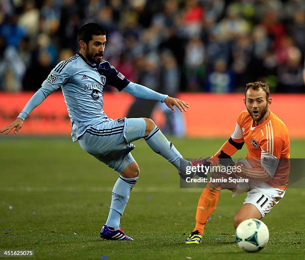 Paulo Nagamura of the Sporting KC battles Brad Davis of the Houston Dynamo for the ball during Leg 2 of the Eastern Conference Championship at...