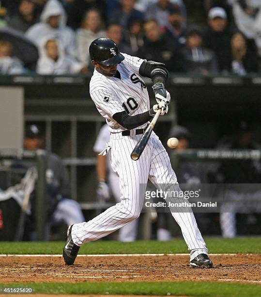 Alexei Ramirez of the Chicago White Sox hits a two-run single in the 4th inning against the Los Angeles Angels of Anaheim at U.S. Cellular Field on...