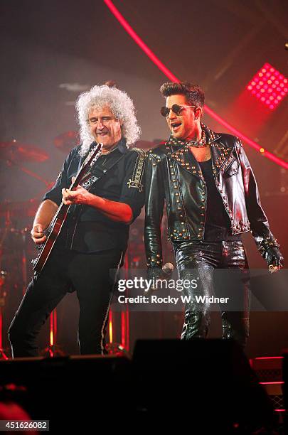 Brian May of Queen and Adam Lambert perform in concert at the SAP Center on July 1, 2014 in San Jose, California.