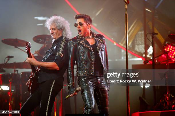 Brian May of Queen and Adam Lambert perform in concert at the SAP Center on July 1, 2014 in San Jose, California.