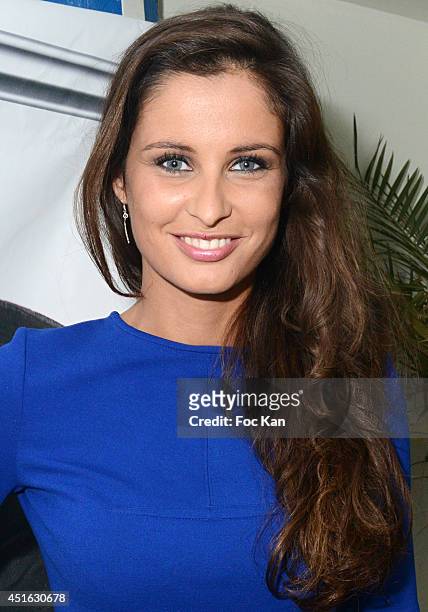 Miss France 2012 Malika Menard attends The 'Laure Manaudou Design' Swimming Suit show at Piscine Billancourt on July 2, 2014 in Paris, France.