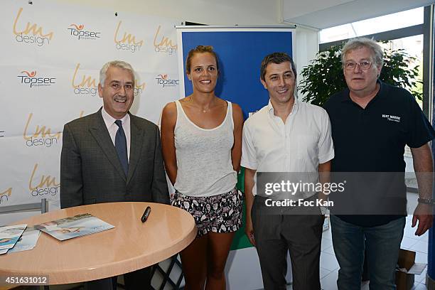 Boulogne Billancourt mayor Pierre Christophe Baguet, Laure Manaudou and and mayor team members attend the 'Laure Manaudou Design' Swimming Suit show...