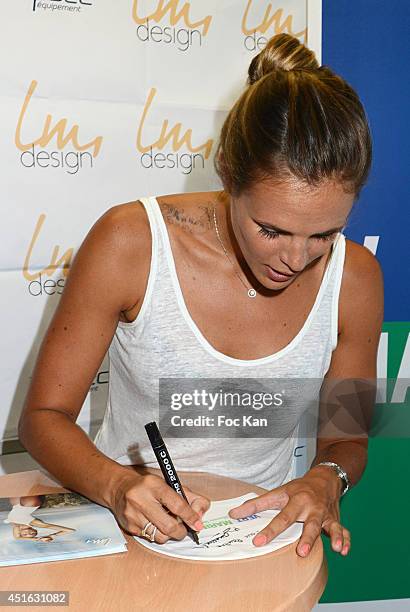 Laure Manaudou attends the 'Laure Manaudou Design' Swimming Suit show at Piscine Billancourt on July 2, 2014 in Paris, France.