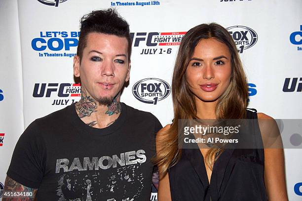 Guitarist Dj Ashba of Guns N' Roses and wife Nathalia Henao arrives at UFC's advance screening of the Twentieth Century Fox film 'Let's Be Cops'...