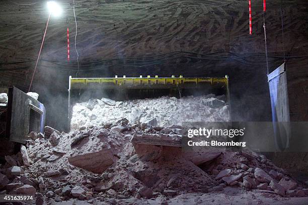 Low loader works in underground tunnels to carry a bucket of crude salt, used to make potash, magnesium and sulfate for speciality fertilizers, at...