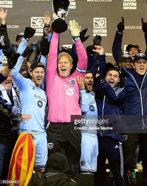 Captain Jimmy Nielsen of the Sporting KC hoists the trophy with teammates after Sporting KC defeated the Houston Dynamo to win the Eastern Conference...