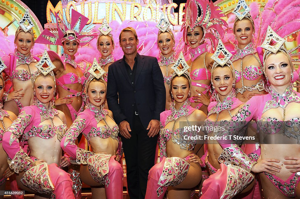 Shane Warne Visits Le Moulin Rouge In Paris