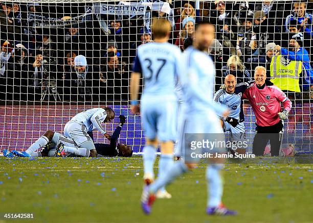 Ike Opara, C.J. Sapong, Aurelien Collin, and Jimmy Nielsen of the Sporting KC celebrate after Sporting KC defeated the Houston Dynamo 2-1 to win the...
