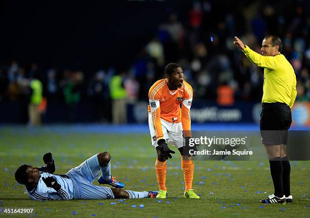 Kofi Sarkodie of the Houston Dynamo protests a call by referee Baldmero Toledo after fouling C.J. Sapong of the Sporting KC during Leg 2 of the...