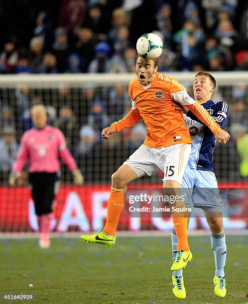 Cam Weaver of the Houston Dynamo beats Matt Besler of the Sporting KC for a head ball during Leg 2 of the Eastern Conference Championship at Sporting...