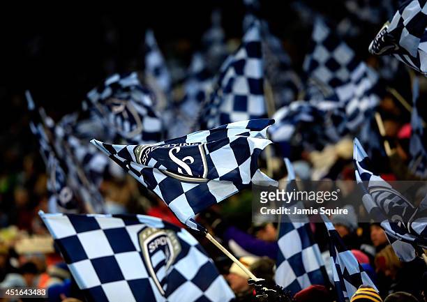 Sporting KC fans wave flags during Leg 2 of the Eastern Conference Championship against the Houston Dynamo at Sporting Park on November 23, 2013 in...