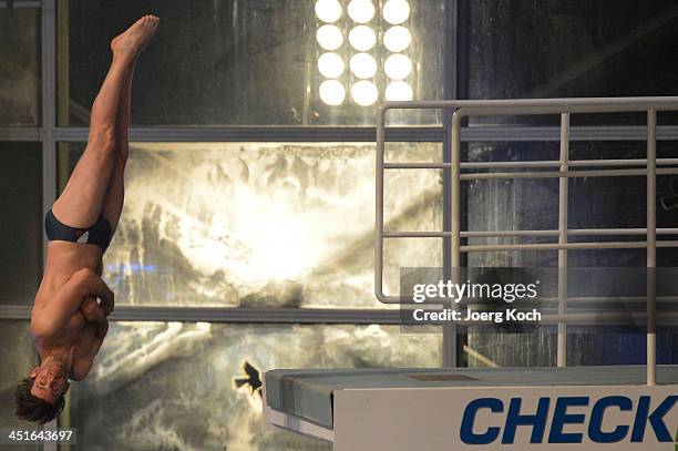 Steffen Grothe jumps during the TV show 'TV Total Turmspringen' from a diving board on November 23, 2013 in Munich, Germany. 'TV Total Turmspringen'...