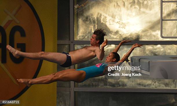 Annabelle Mandeng and Steffen Groth jump during the TV show 'TV Total Turmspringen' on November 23, 2013 in Munich, Germany. 'TV Total Turmspringen'...