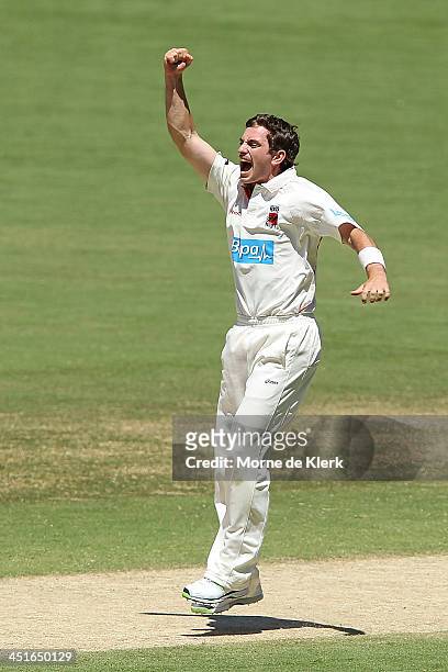 Chadd Sayers of the Redbacks celebrates after getting a wicket during day three of the Sheffield Shield match between the South Australia Redbacks...