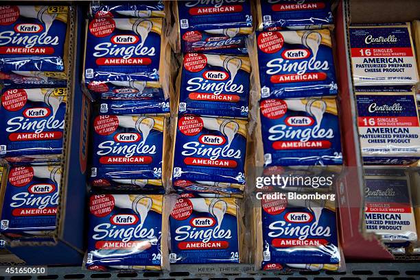 Packages of Kraft Foods Group Inc. Sliced American cheese sit on display for sale in a supermarket in Princeton, Illinois, U.S., on Wednesday, July...