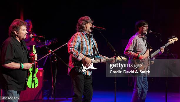 Jeff Cook, Randy Owen, and Teddy Gentry of Alabama perform at the Birmingham Jefferson Civic Center Concert Hall on November 23, 2013 in Birmingham,...